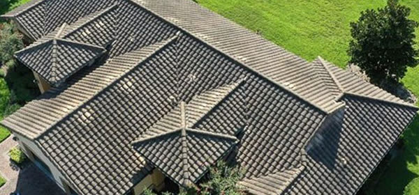 Tile roof before soft washing, dark with algae